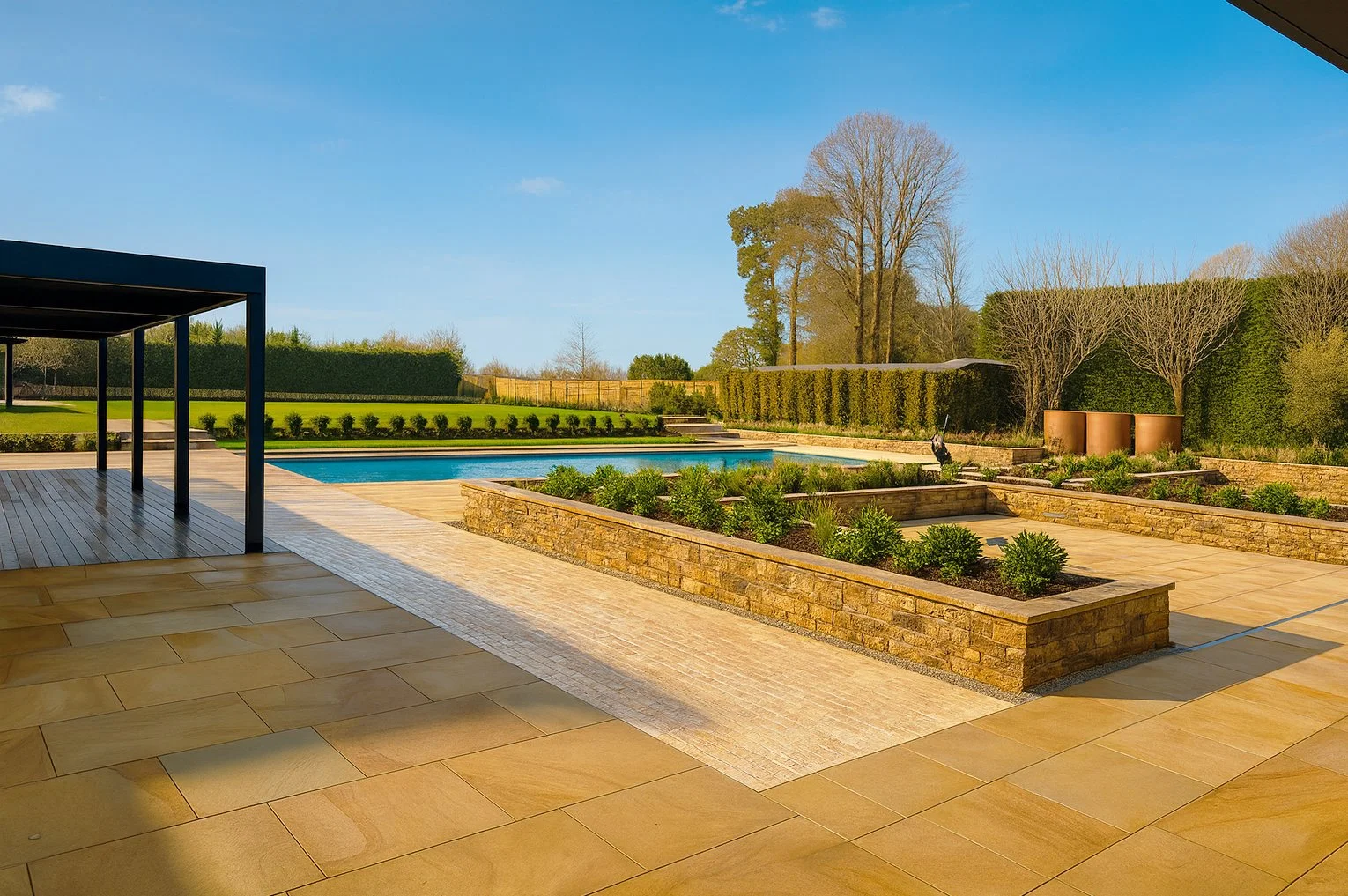 garden design featuring a luxury swimming pool with crystal blue water, stone terraces, and lush planting in Oxfordshire.