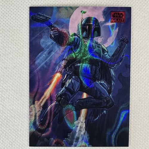A colorful sci-fi illustration of a Mandalorian soldier from Star Wars, with blasters, jet thrusters, and a holographic background.