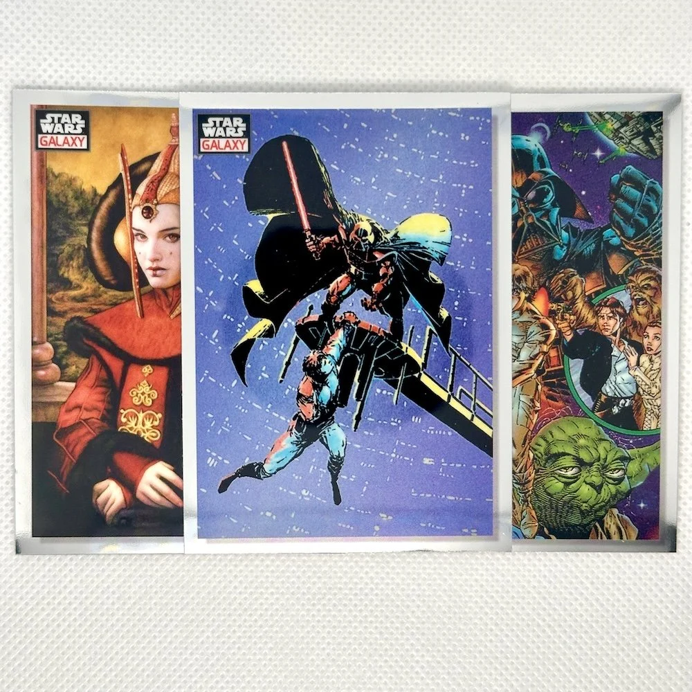 Set of three Star Wars galaxy-themed cards featuring characters from the Star Wars franchise, including Queen Padmé Amidala on the left, Darth Vader battling an enemy in the middle, and a collage with Yoda and other characters on the right.