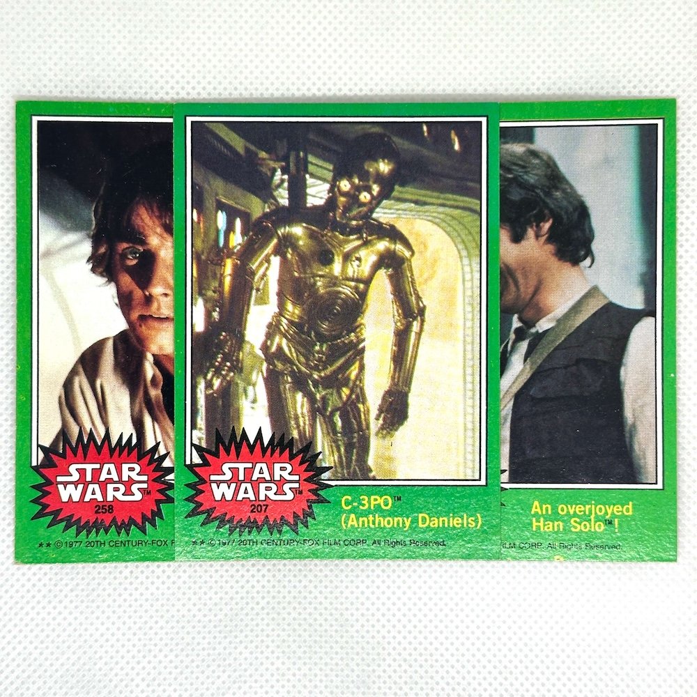 Three separate images from Star Wars trading cards featuring Princess Leia, C-3PO, and Han Solo with captions and logos.