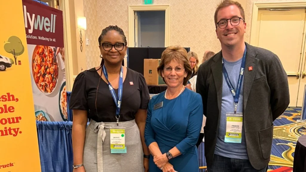 Fred standing with other attendees at an event