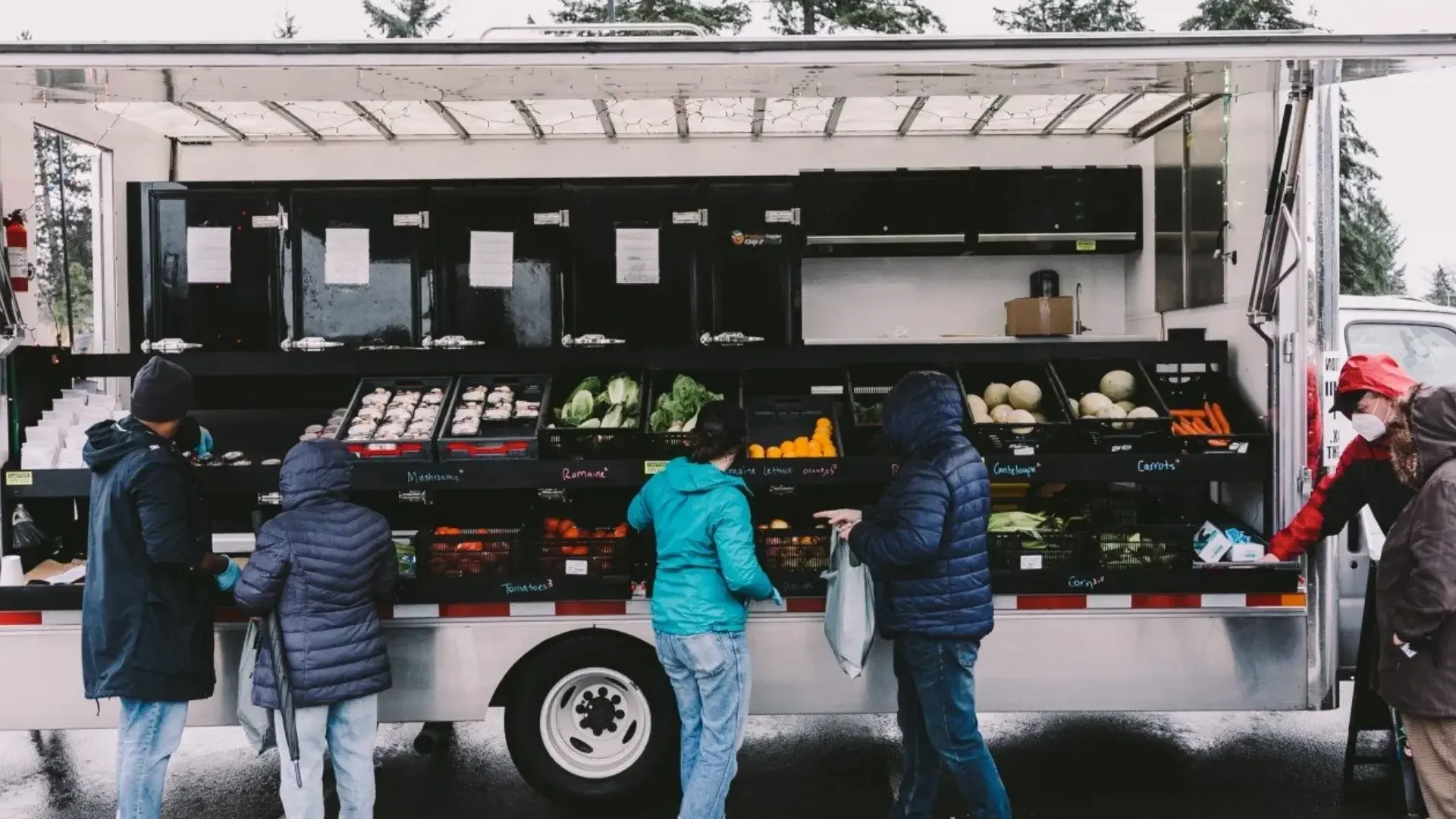 Community members shopping at mobile market truck