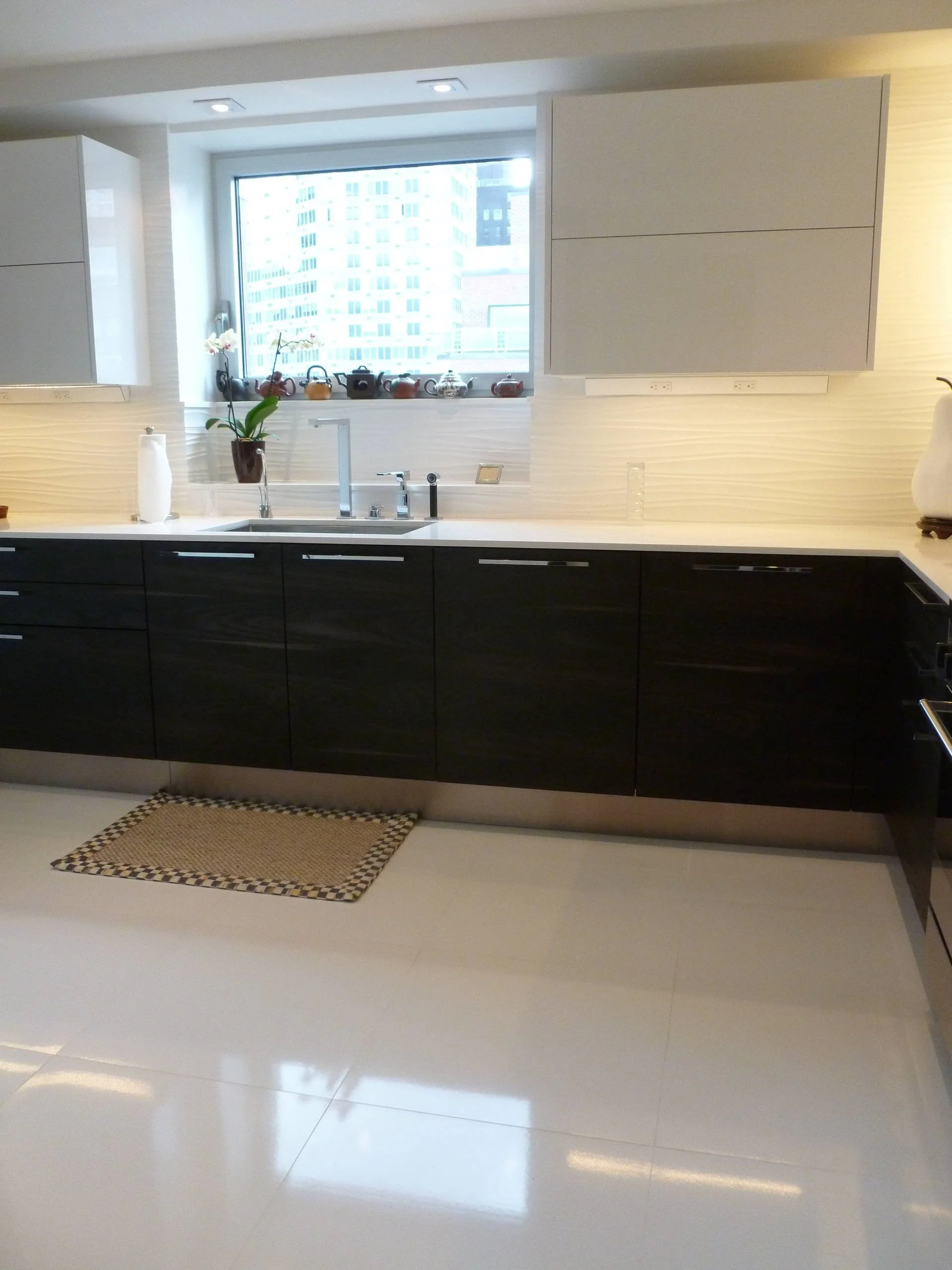 Before and after NYC apartment kitchen remodeling with modern cabinetry and countertops