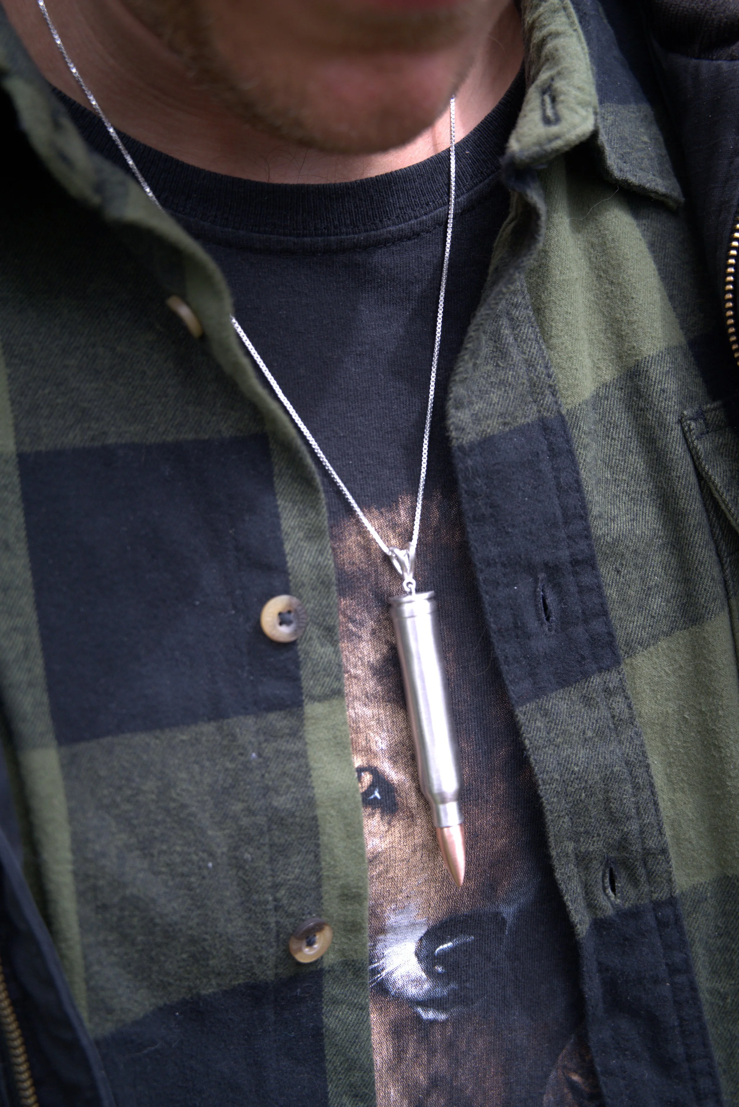 300-win-mag-silver-bullet-pendant-on-neck-3-legion-of-none.jpg.jpeg