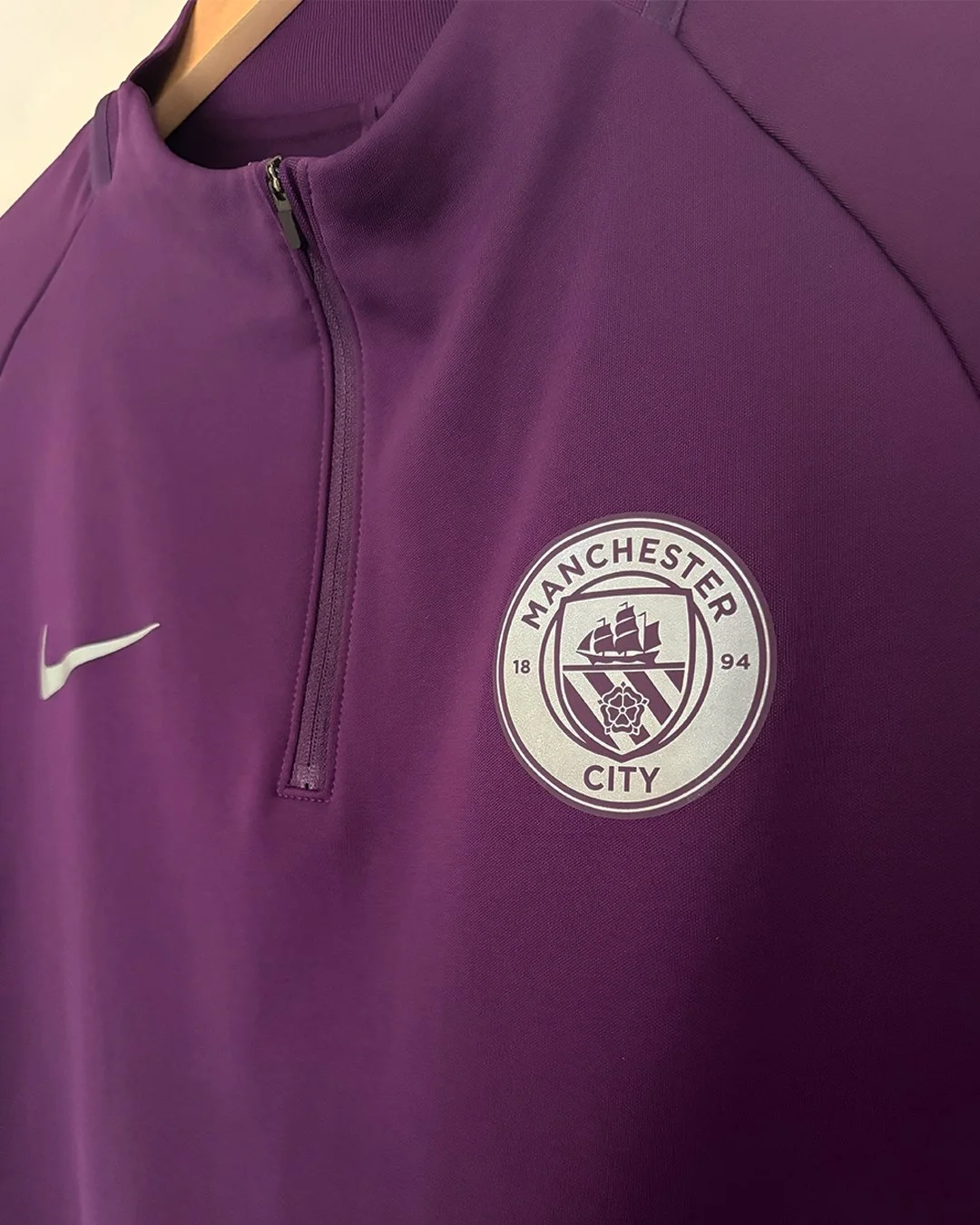ManCity_QuarterZip_Purple_Crest.jpg