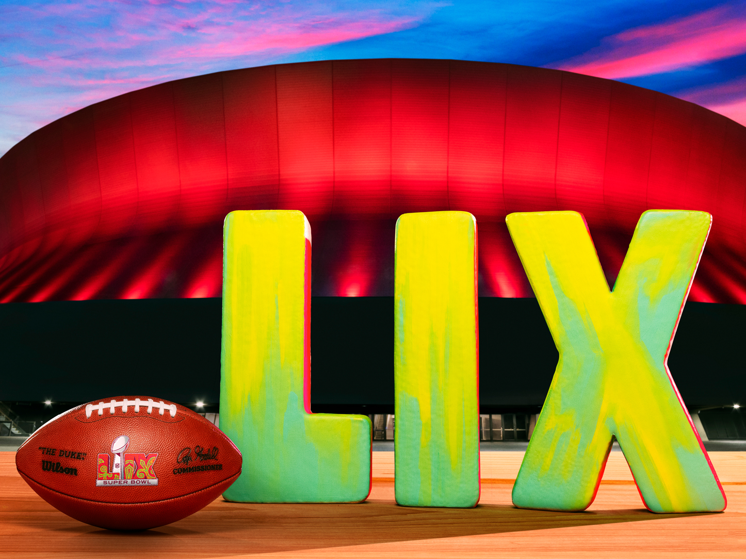 Super Bowl LIX football in front of New Orleans stadium