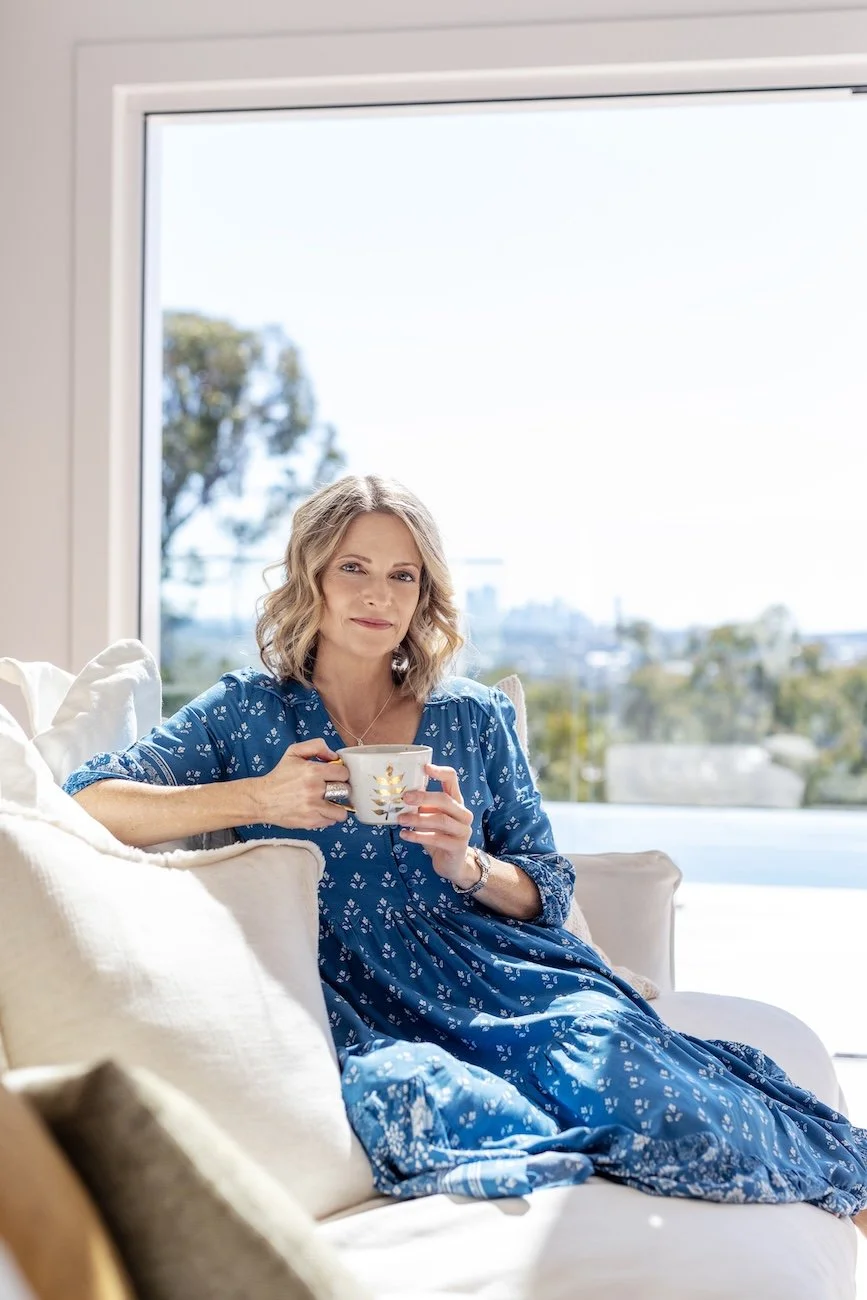 Paula Corban, Gold Coast naturopath, relaxing with tea at Saffron Natural Health Robina, symbolising balance, clarity, and natural hormone support.