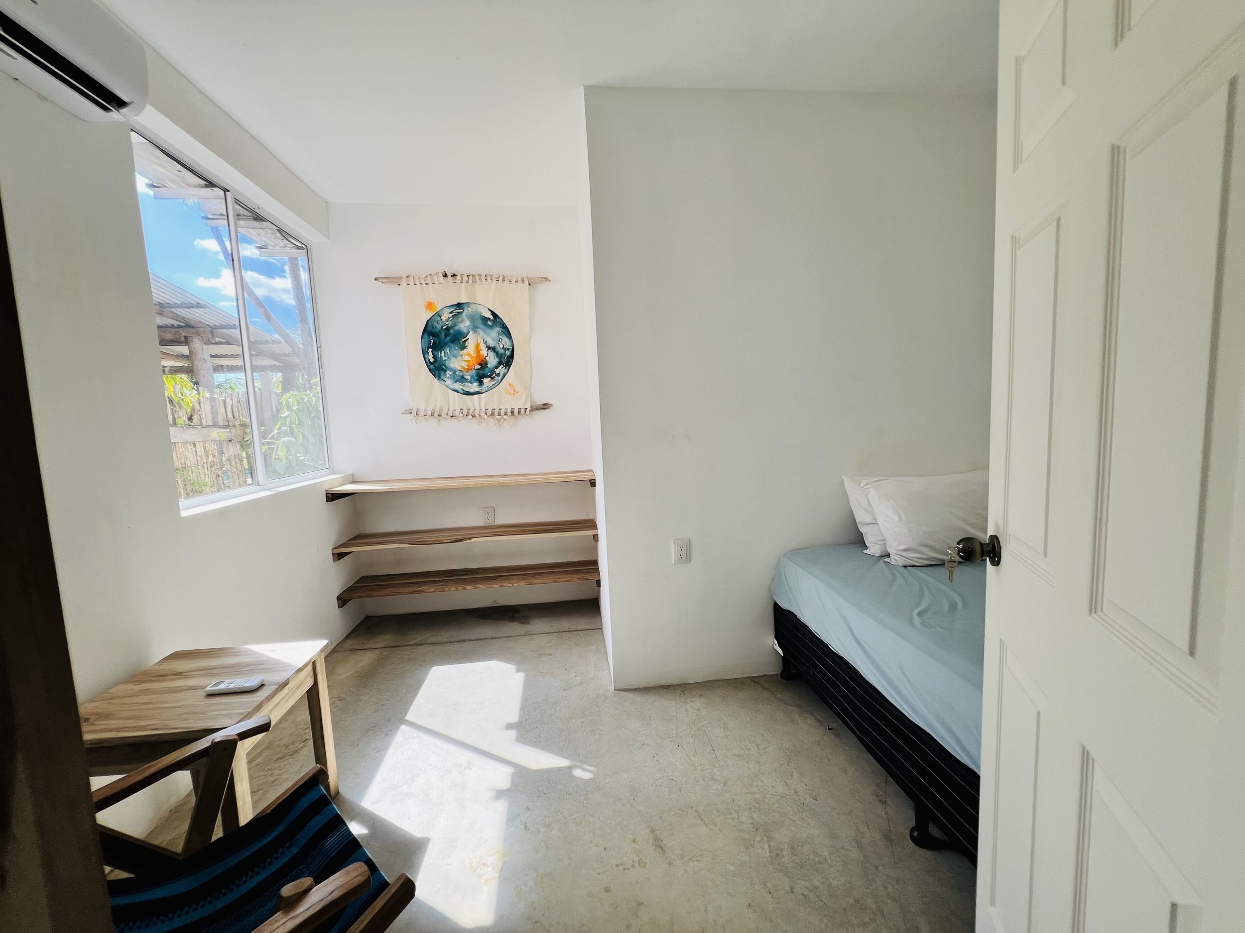 Single room with queen size bed.