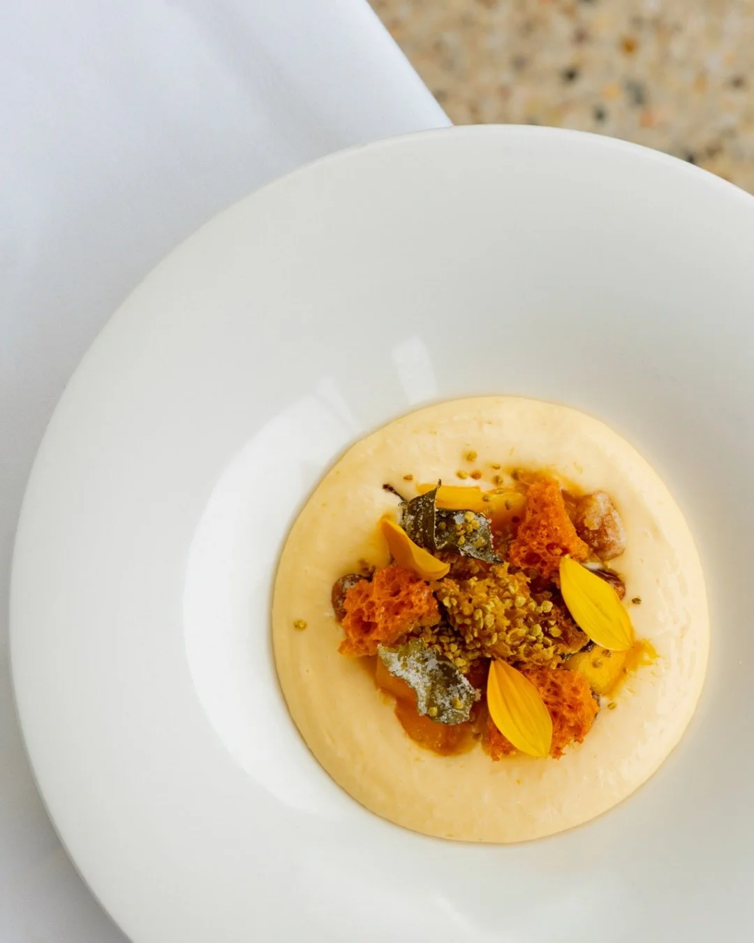 Mango at its peak, layered with bright citrus and texture.

Chef Barret brings it together, step by step, to create a refreshing highlight to any afternoon spent on the coast.