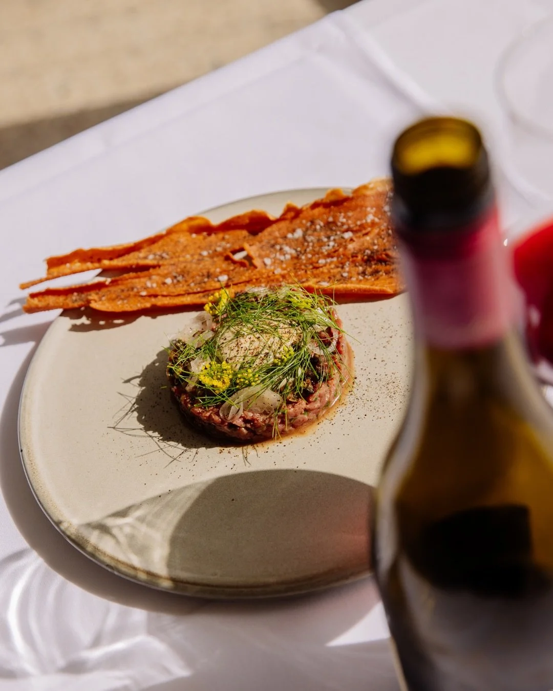 Kingfishers Bend Farm beef tartare with baba ganoush, fennel, and a sourdough cracker. 

Pair it with a glass of red and settle in.