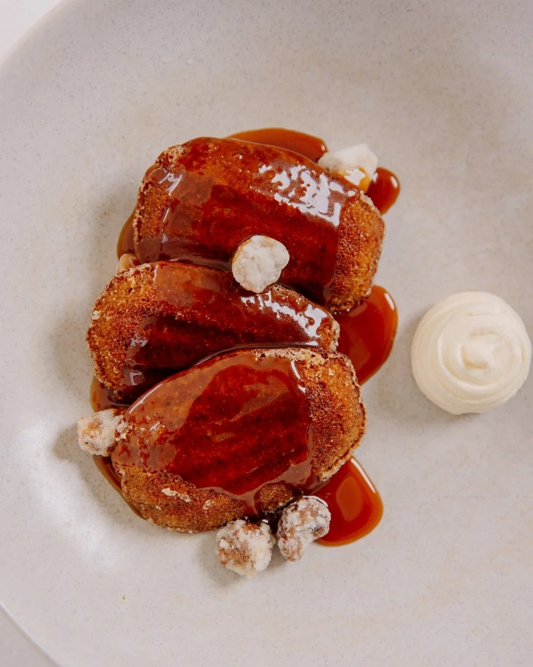 A slow close to lunch or dinner by the bay.

Medjool date madeleines under butterscotch and smoked cr&egrave;me fraiche, finished with macadamia. Mille Feuille layered with pineapple, coconut and passionfruit ripple ice cream.
And a dark chocolate ma