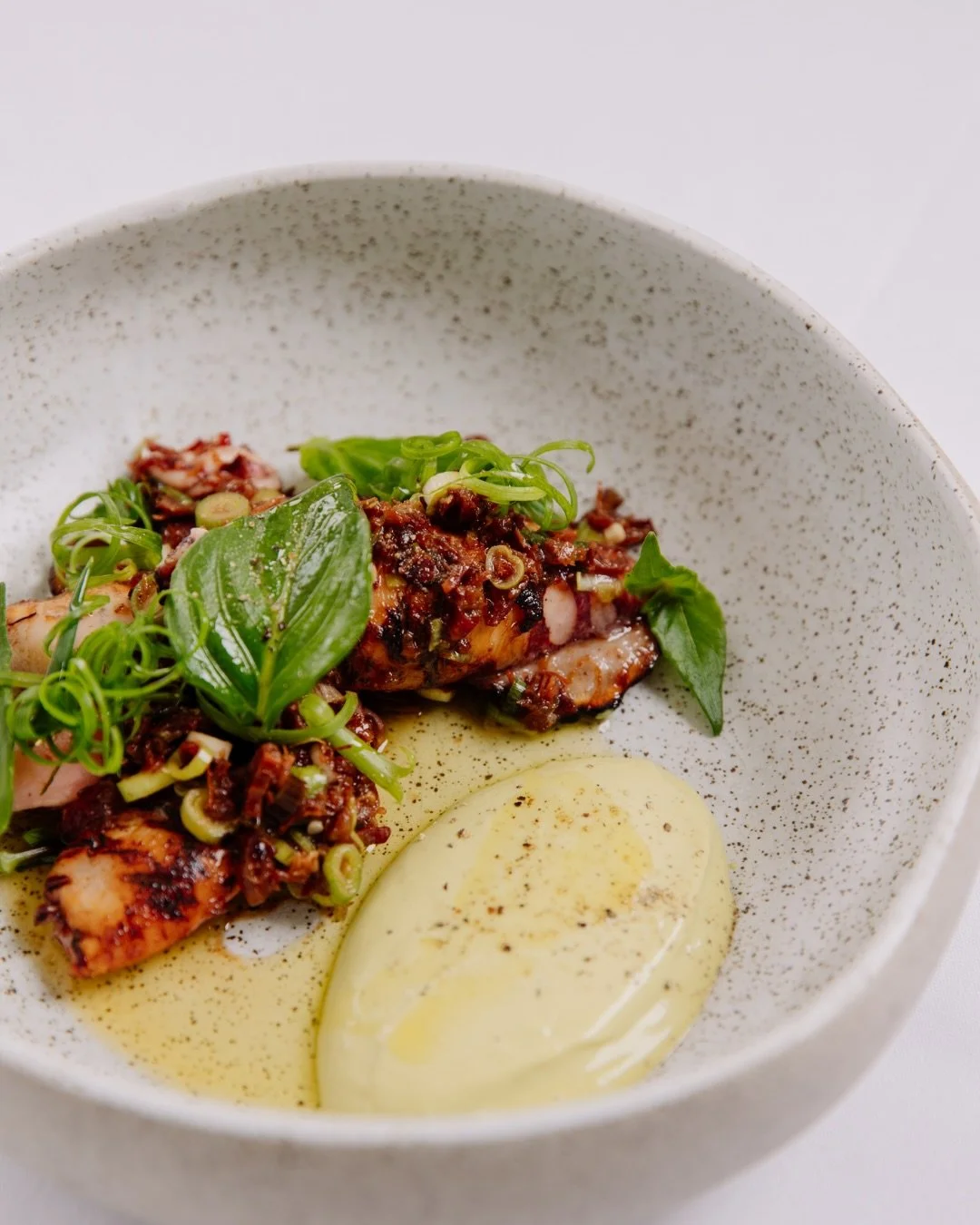 Barbecued squid with XO sauce, spring onion and black pepper - smoky, savoury, and full of depth.

A lighter way to start lunch by the bay, best shared across the table with a glass of wine and the afternoon ahead.

Join us this weekend.