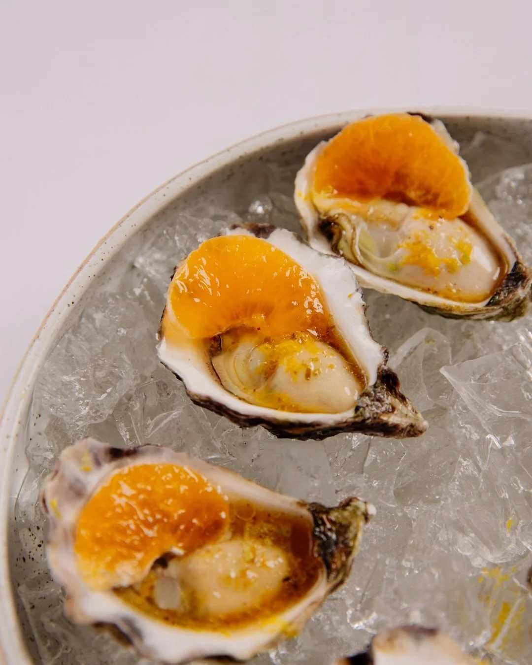 Freshly shucked oysters, finished with mandarin and yuzu kosho oil.

Mandarins sourced from @consciousground at @byronfarmers , bringing a bright seasonal note that complements the natural salinity of the oysters. Simple ingredients, thoughtfully sou