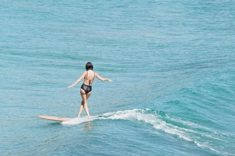 woman surfing in noosa