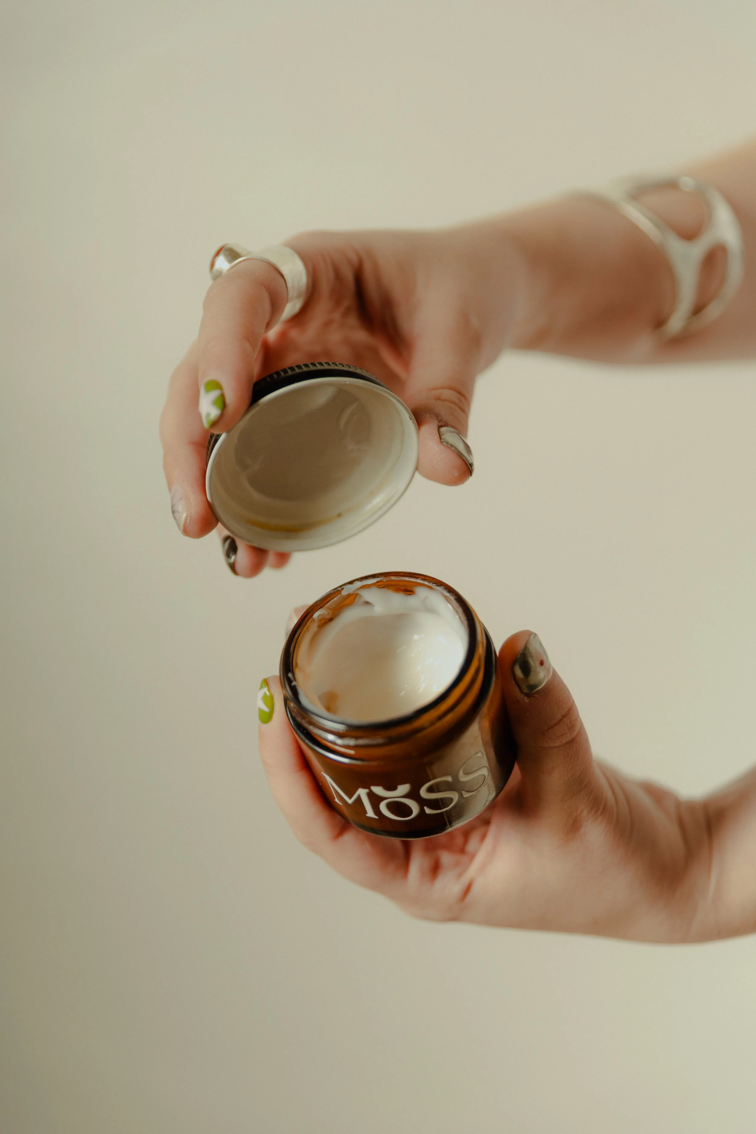 Hands holding a super soothing moisturizing cream