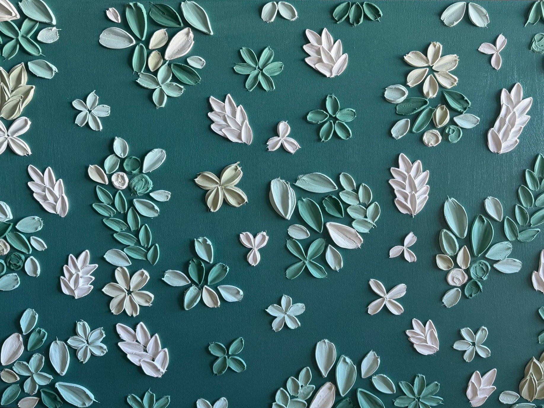 A commissioned piece featuring hand-painted petals using soft greens and whites on a deep green teal background