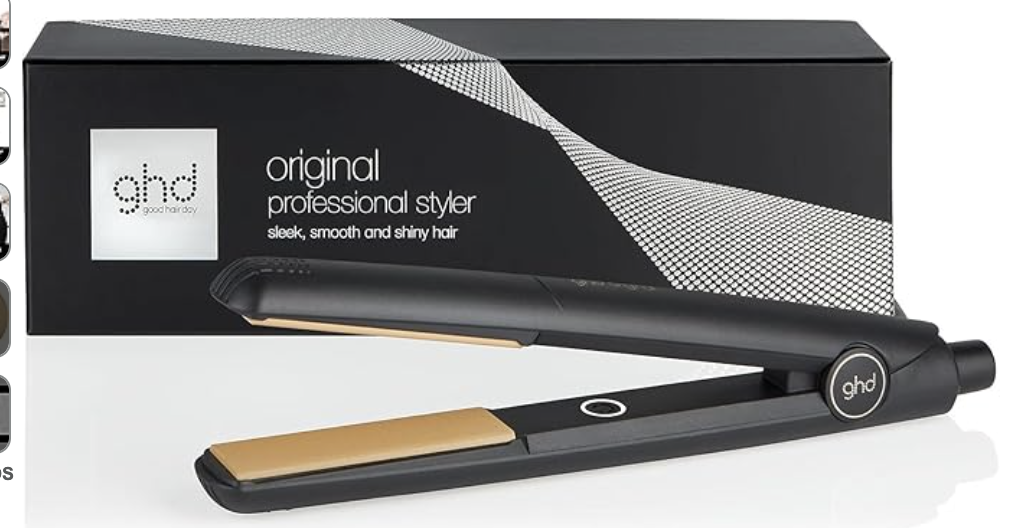 Black ghd original professional styler hair straightener with gold plates, placed in front of its box.