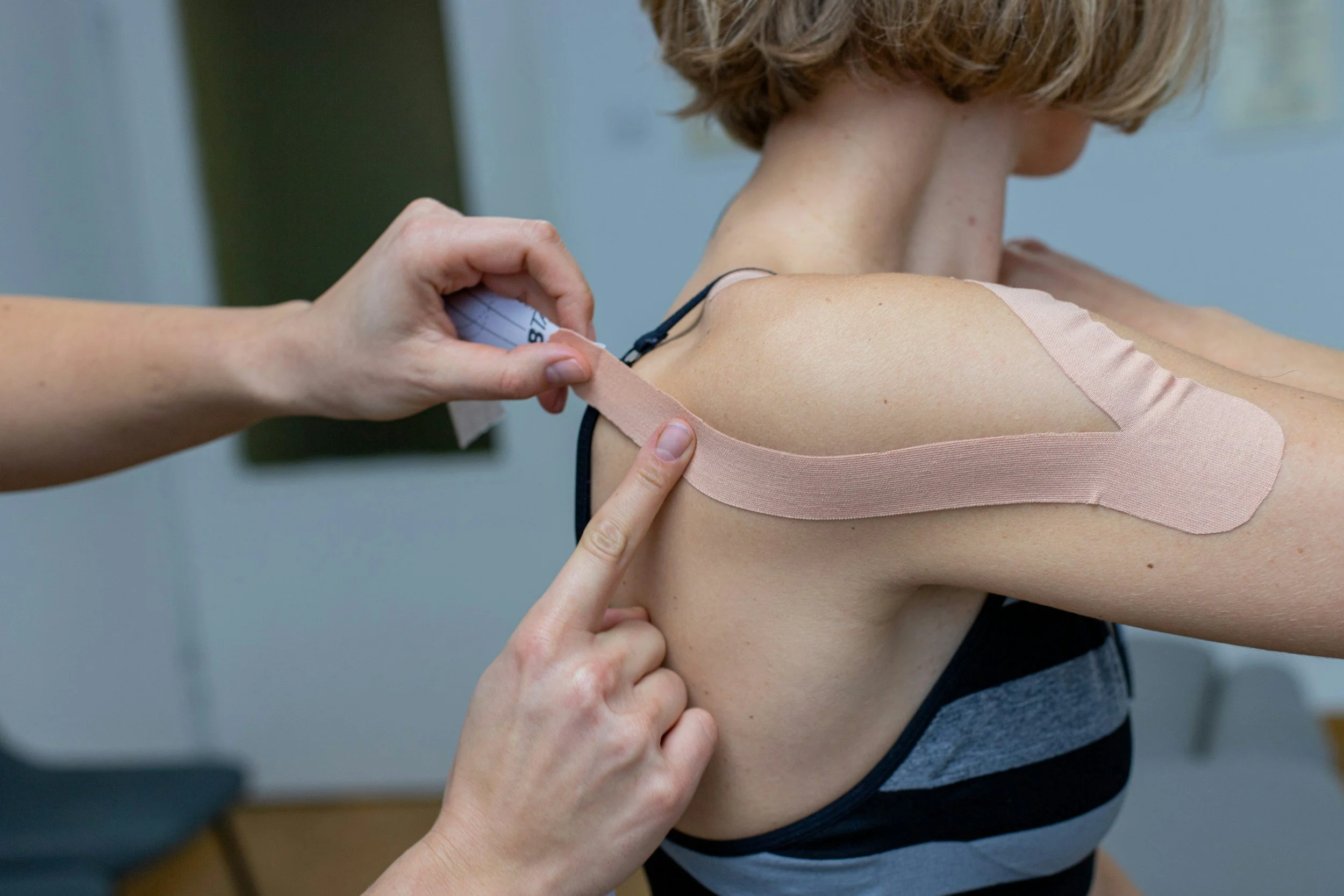 Kinesiology tape to reduce pain and maintain mobility