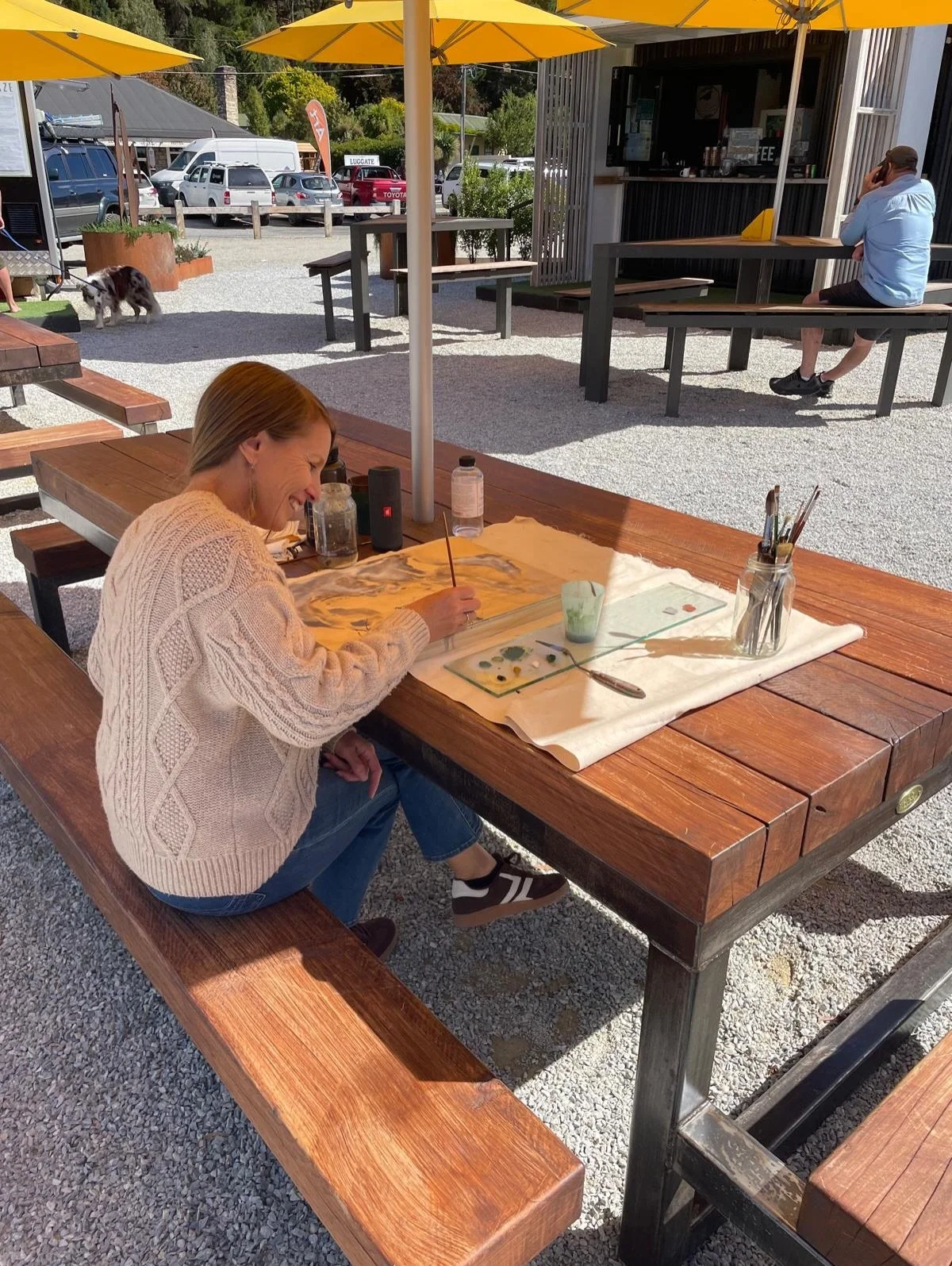 Sophie is on gallery duty today and making most of the warmth in the sun at @thegreenluggate 🌞 She is painting oil on plywood for our next group exhibition opening in two weeks! This is &lsquo;Above from Below&rsquo; Looking up at the clouds on a su