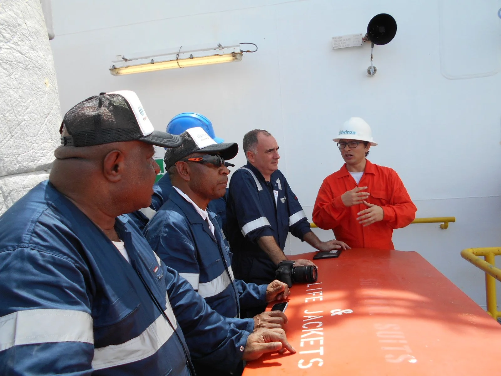 Men talking on site with Twinza