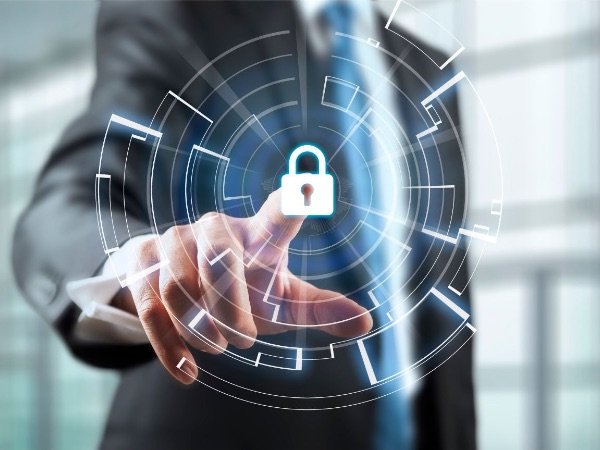 A person in a business suit pressing a virtual lock icon on a futuristic digital interface