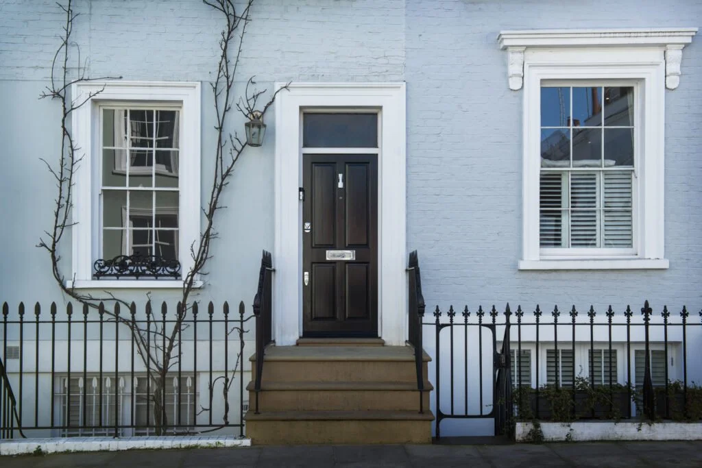 front-view-front-door-with-blue-wall-plants-1024x683.jpg