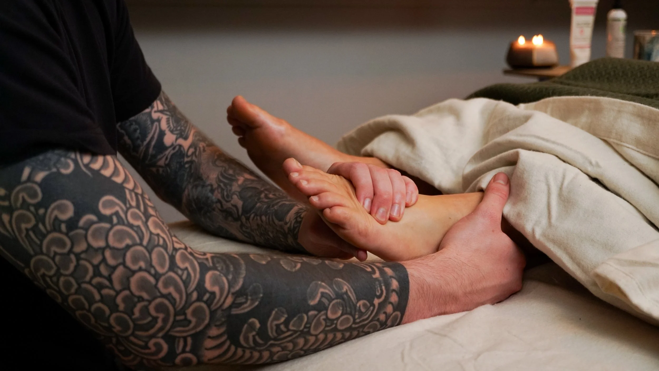 Person receiving a targeted foot massage.