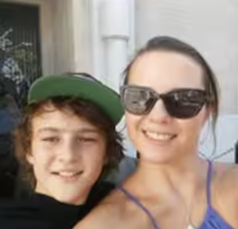 Mother and son smiling with sunglasses and cap
