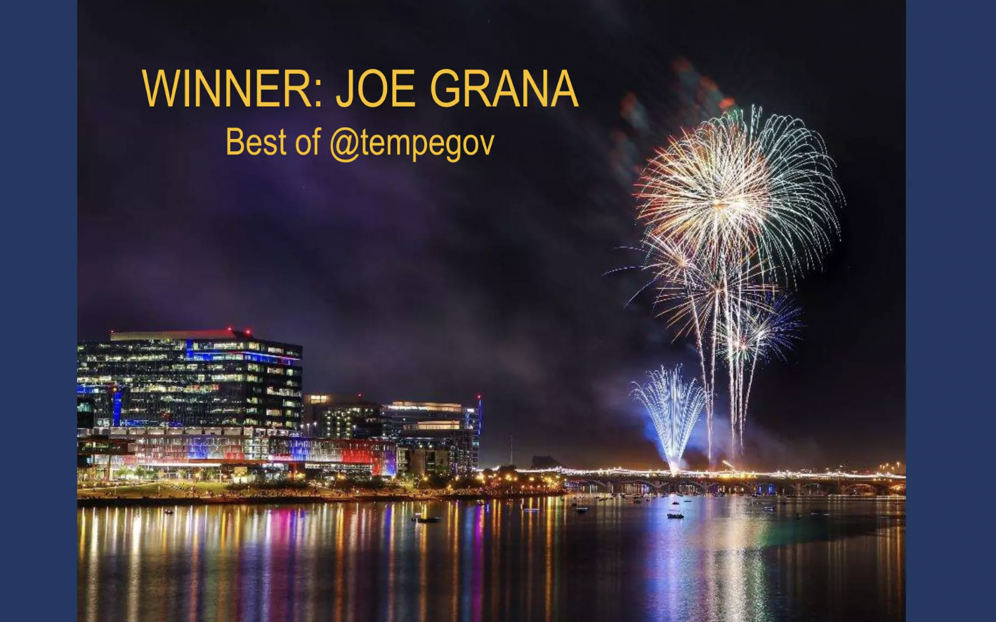 A cityscape at night with colorful fireworks in the sky reflecting on a river, and text overlaid that reads, 'WINNER: JOE GRANA Best of @tempegov'.