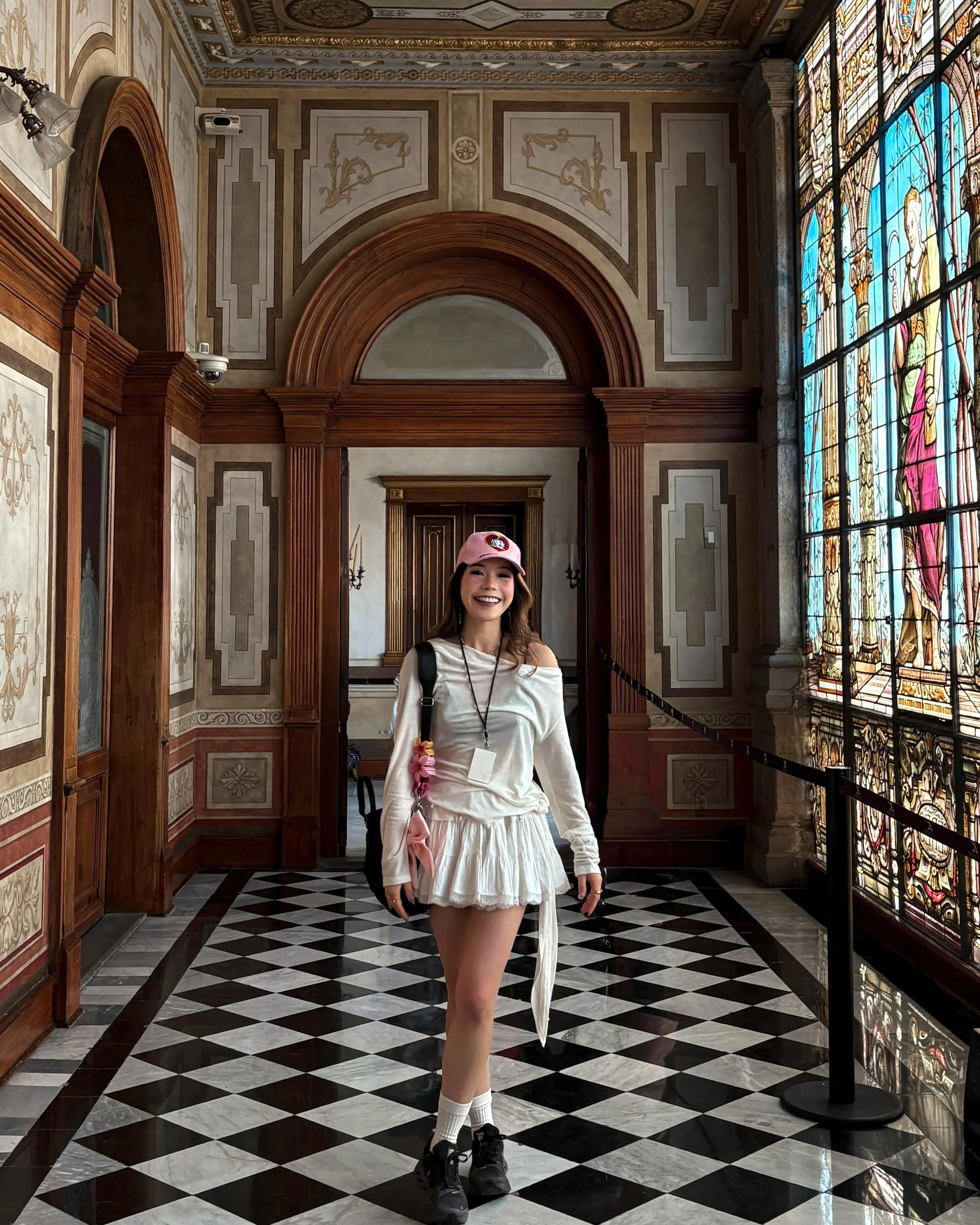 I love an outfit that can survive a full excursion and still look cute in photos.

This one was simple: soft white layers, sneakers, a practical bag, and a pink cap for a little personality.

Later, you could tousle the hair, swap in heels and a tiny