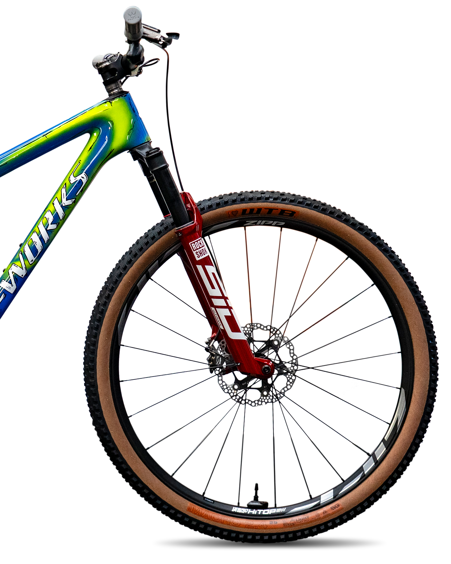 Close-up of a mountain bike's front section showing a red suspension fork, black handlebar, and brown tire with the brand Zipp on it.