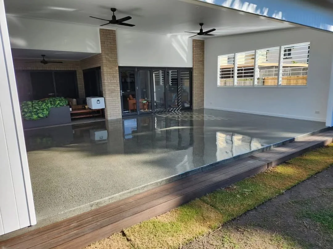 Modern covered outdoor patio area with polished concrete floor