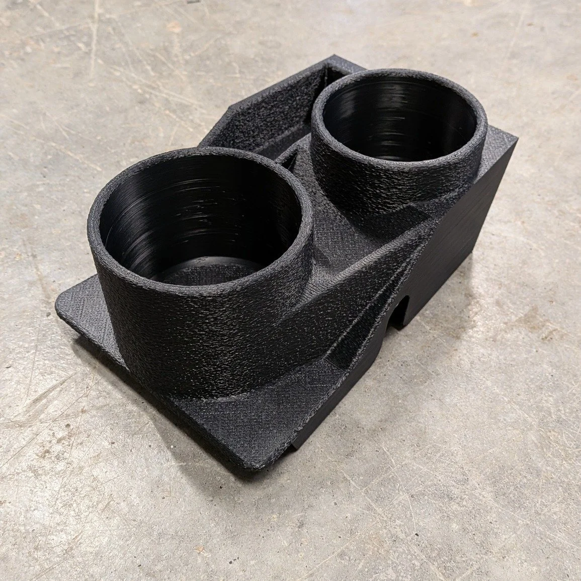 Massive upgrade for your Nissan GQ Patrol interior! 

Our V2 Centre Console Cup Holders feature:
- 70mm rear cup holder (cans &amp; bottles)
- 81mm front cup holder (stubby coolers &amp; large bottles)
- Extra storage pocket for cards &amp; hardware
