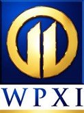 WPXI logo with a gold circle and blue background
