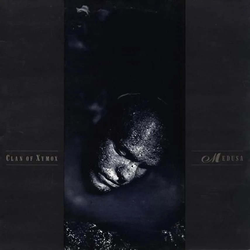 Album cover with a close-up of a person's face covered in glitter or reflective material, with closed eyes, depicted on a dark background with text 'Clan of Xymox' on the left and 'Medusa' on the right.