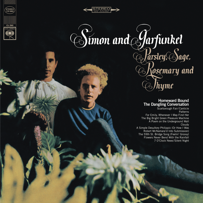 Album cover featuring two men, one with blonde curly hair and the other with dark hair, surrounded by colorful flowers. The text lists the album title 'Simon and Garfunkel,' their song titles, and additional album info.