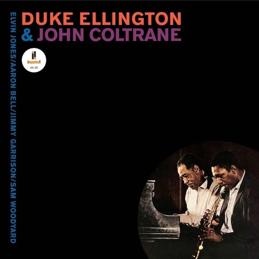 Album cover for Duke Ellington and John Coltrane featuring a photo of two musicians, with Duke Ellington at a piano and John Coltrane playing the saxophone, against a black background with colorful text.