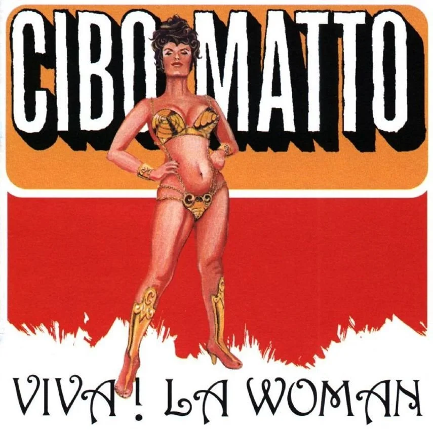 Vintage illustrated advertisement featuring a confident woman wearing a snake-themed bikini and thigh-high boots, standing with her hands on her hips. The background has a bold, colorful design with the text 'CIBO MATTO' and 'VIVA! LA WOMAN' at the bottom.