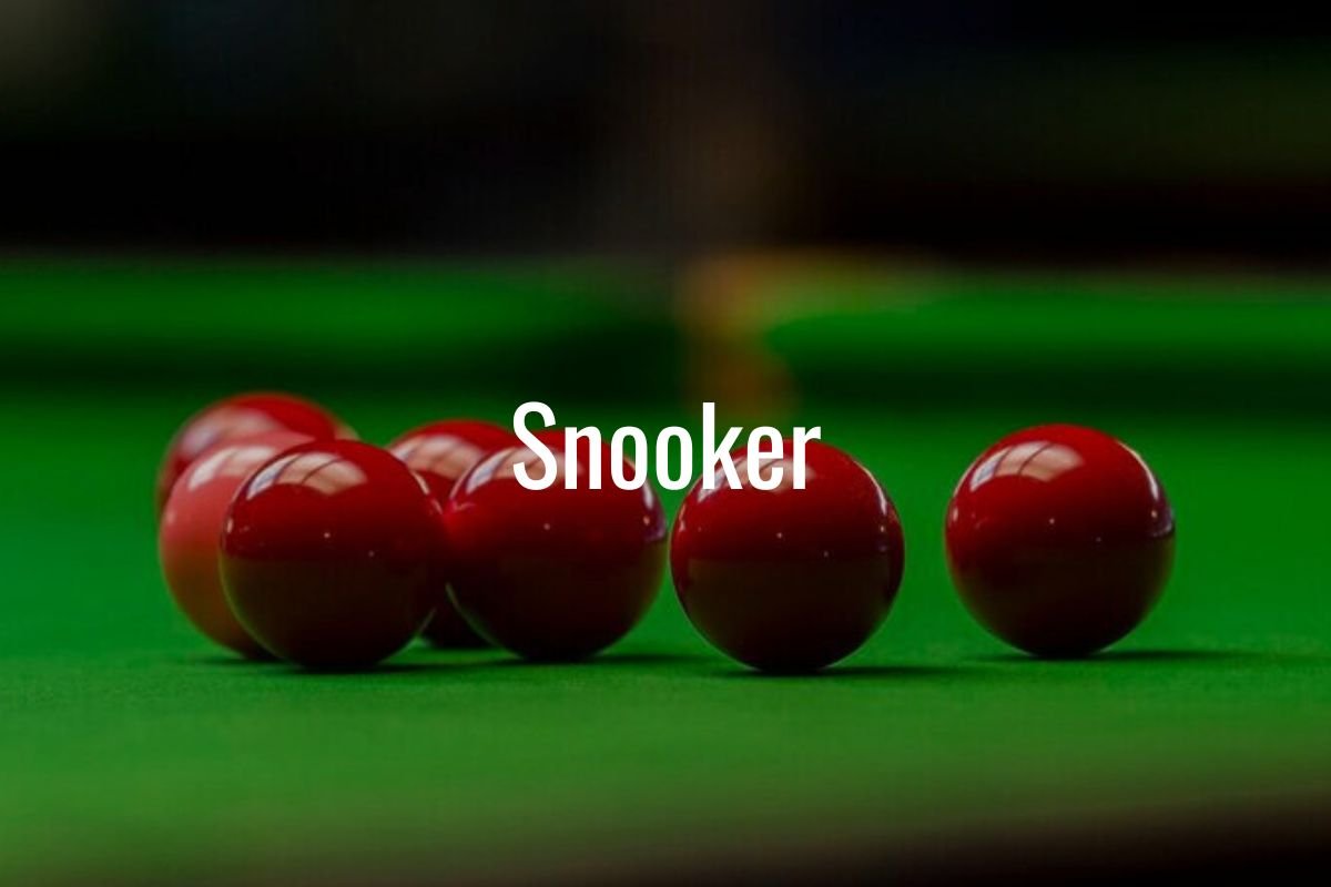 Red snooker balls on a green snooker table with the word 'Snooker' in the center.