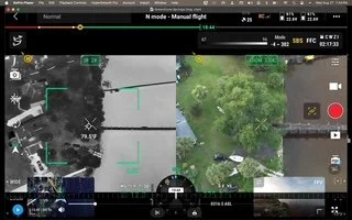 A drone's camera view of a small aircraft flying over a wooded area with a mix of trees and open spaces, seen from above.