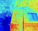 A thermal image showing various temperature zones with colors ranging from blue to red, indicating cooler to warmer areas.