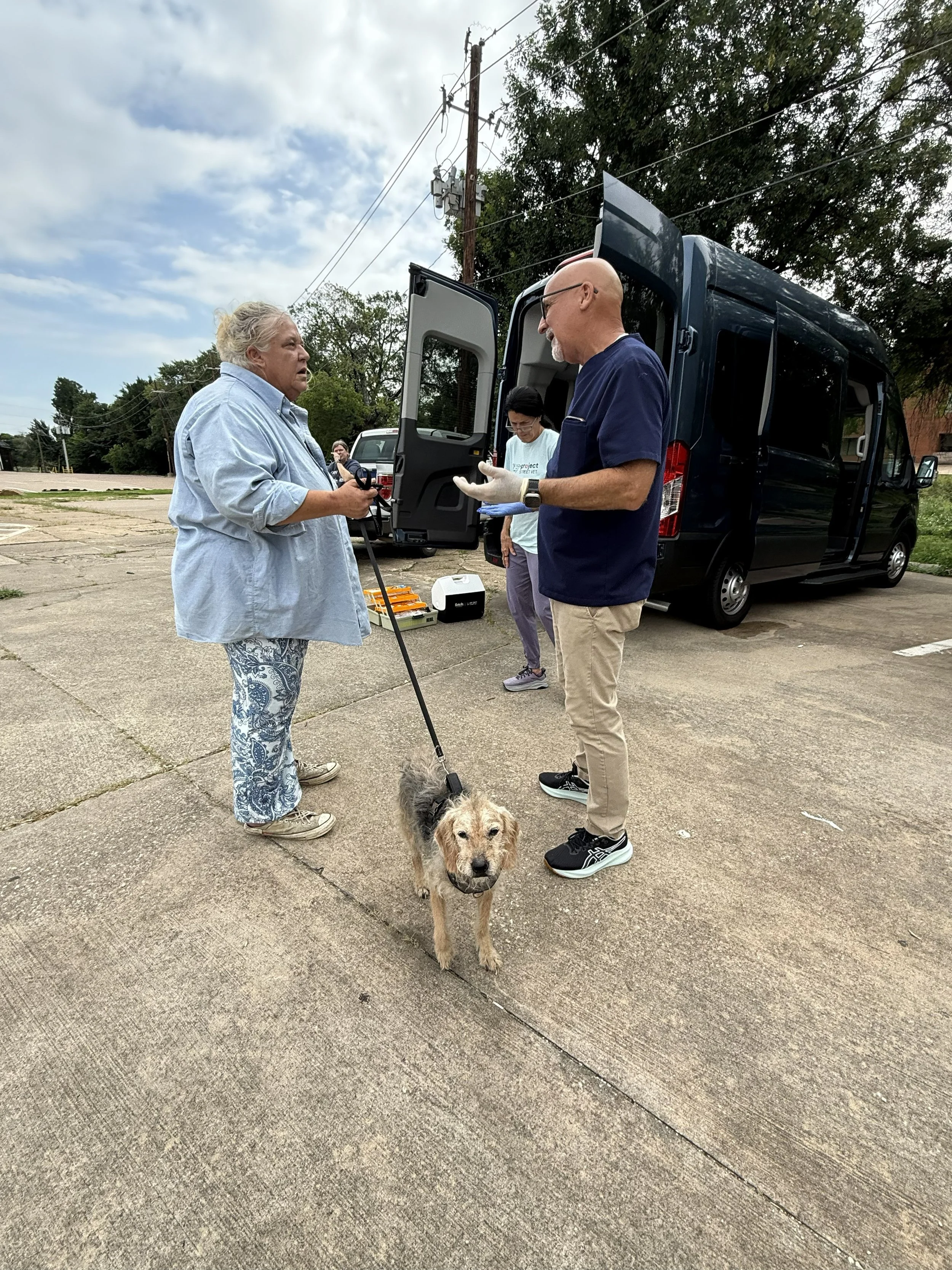 Dr. Randy talking with a pet parent.