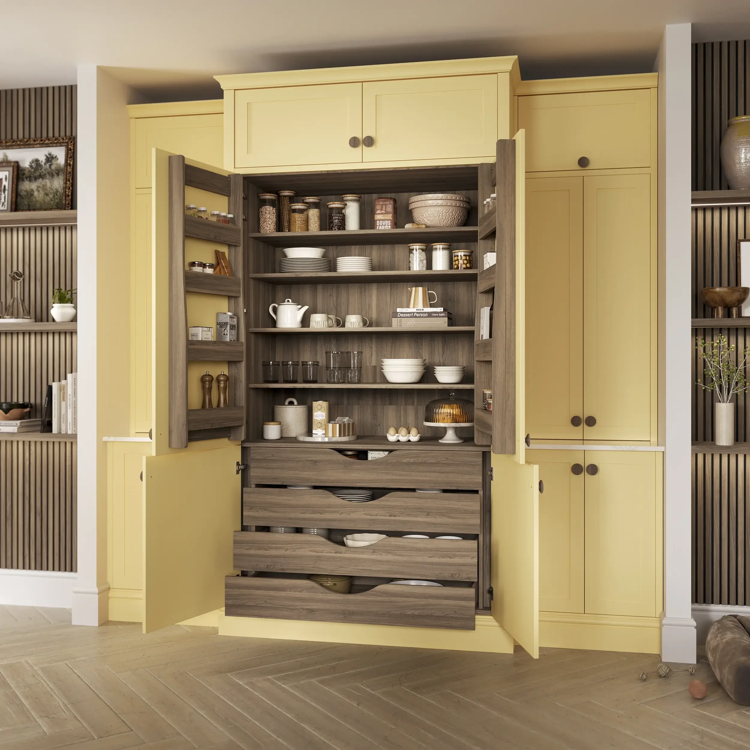 View of an open kitchen cabinet with yellow doors, revealing shelves with dishes, jars, and kitchen items. Part of the kitchen wall with a mixing bowl and decorative elements visible in the background, along with a light wooden floor.