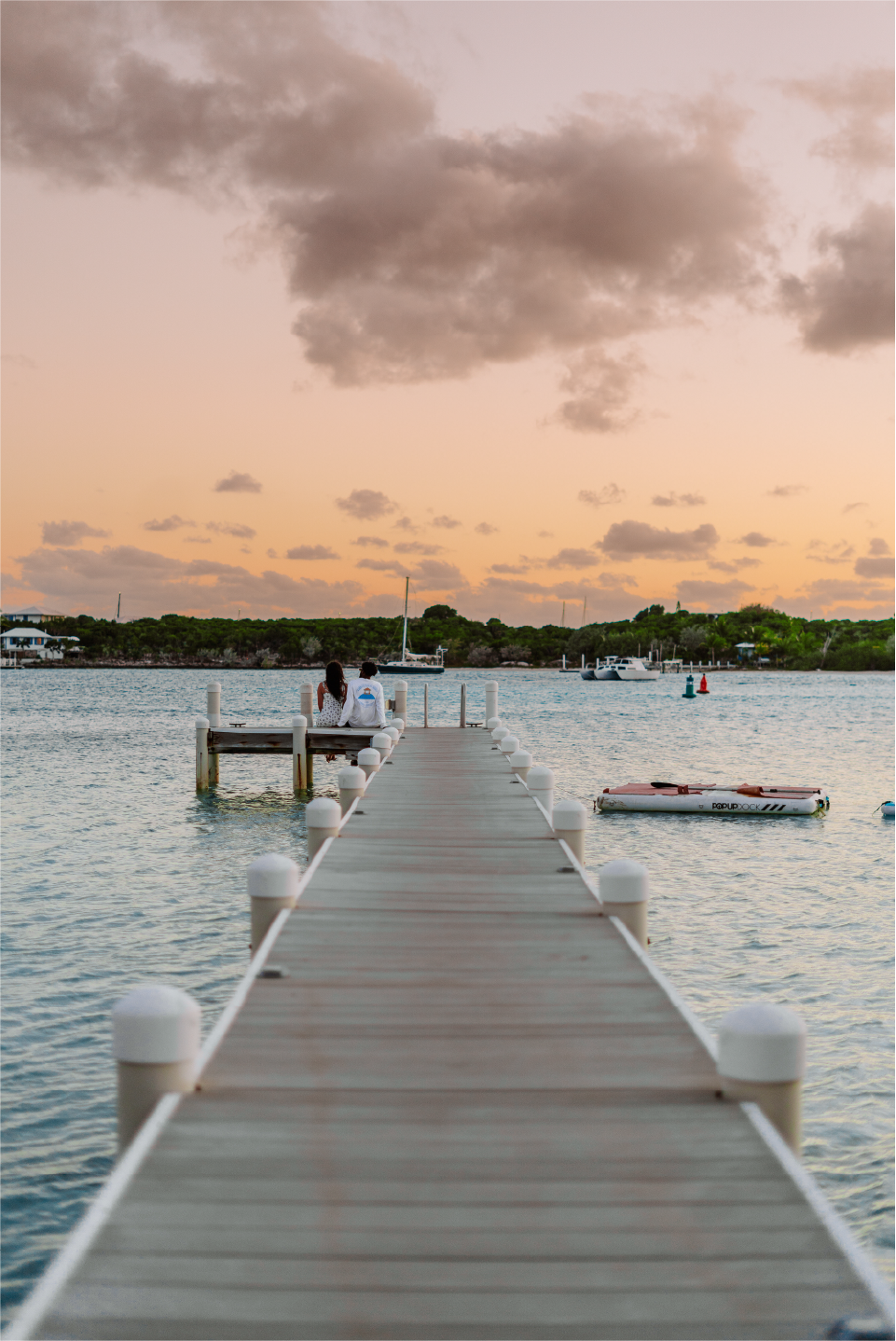 couple enjoying sunset on the private dock at barrier island house