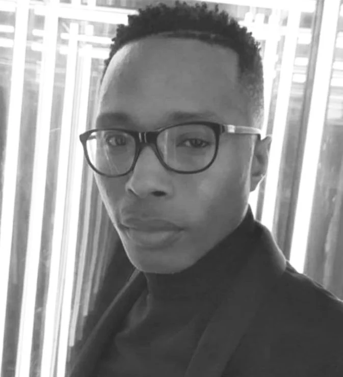 Graphic designer and 3D animation specialist wearing glasses.