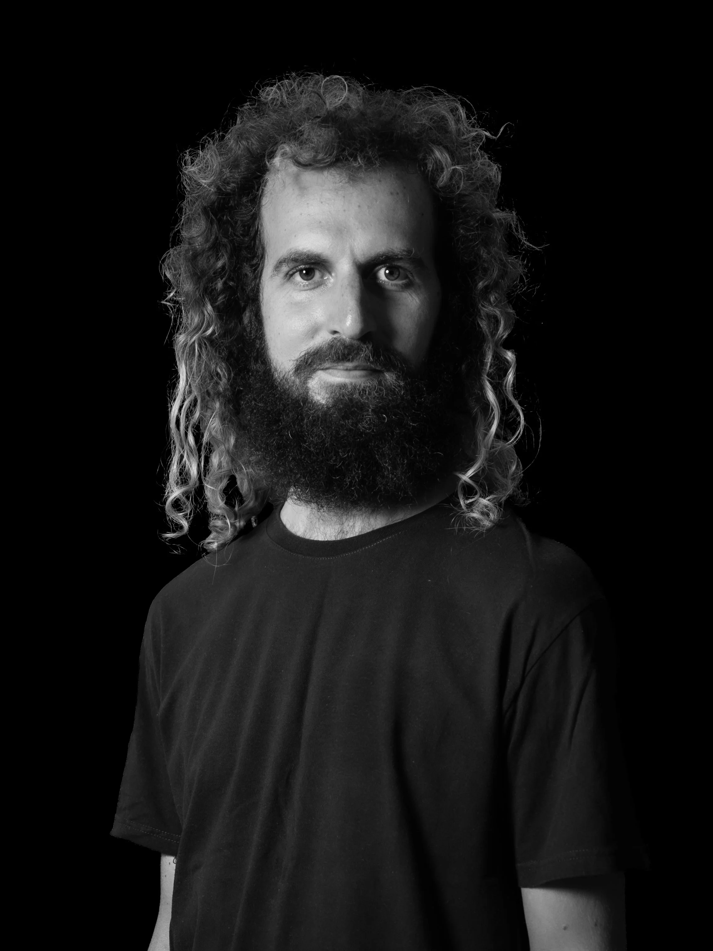 Black and white photo of a cameraman and reel creator