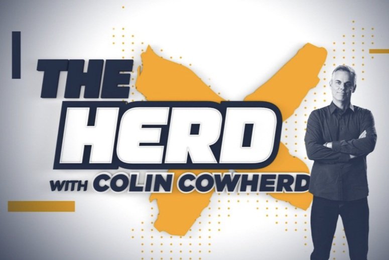 Graphic for the show 'The Hero with Colin Cowherd' featuring Colin Cowherd standing with arms crossed, background of a stylized map of the United States, and bold text with the show's title.