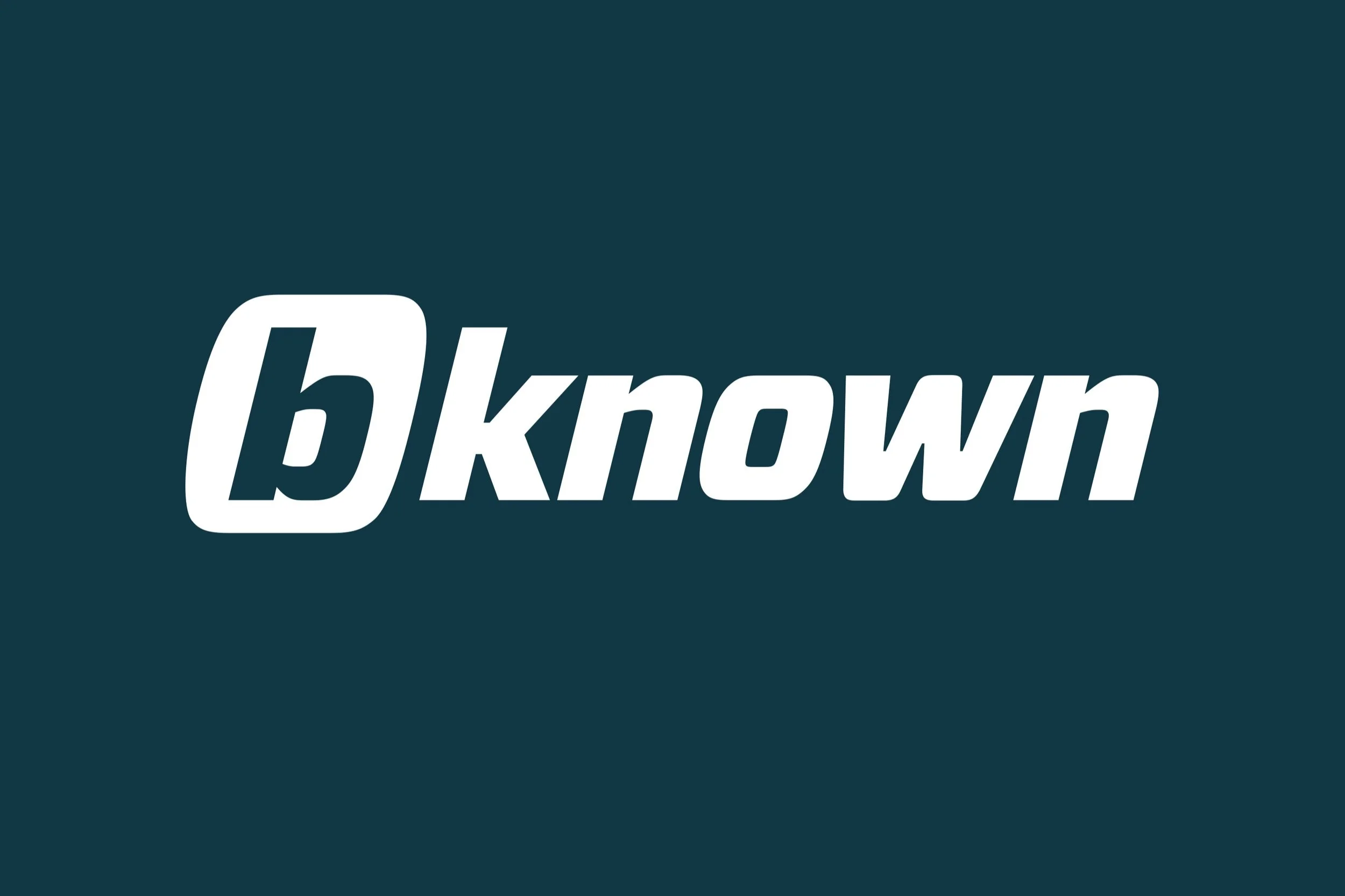 The image displays the word 'bknown' with the letter 'b' in a bold font inside an oval shape, followed by the word 'known' in a stylized font on a dark teal background.