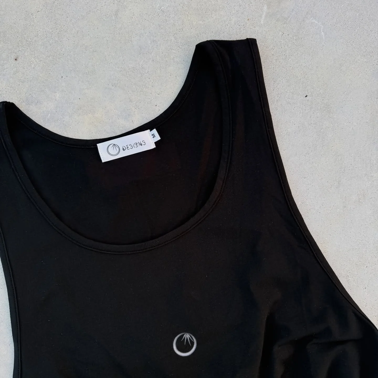 This comfortable and unisex tank top is available in black and white. It has a relaxed fit for a bold style. #blacktanktop #streetwear #Florida #localbusiness #Floridastreetwear #clothing #gymclothing
