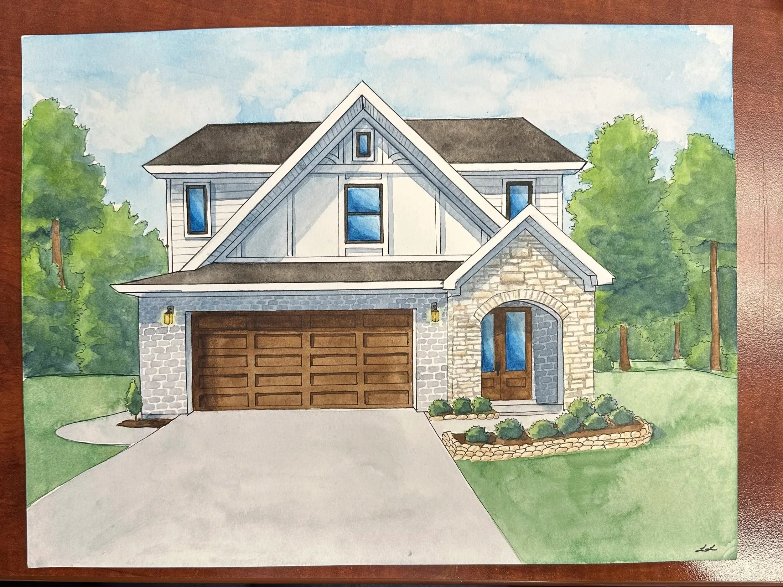 Watercolor painting of a house with a gabled roof, stone accents, and a garage door, surrounded by trees and a landscaped yard.
